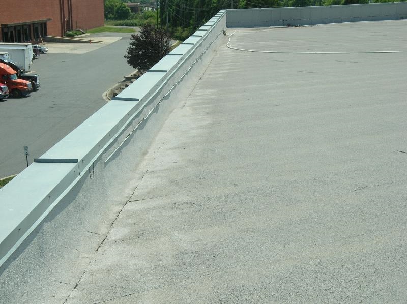 Galvanized steel wall coping with standing seam joints.